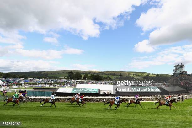 Thomas Dowson riding Beyondtemptation sets the early pace during the Hadwins Motor Group TBA Mares' Handicap Hurdle Race at Cartmel Racecourse on...