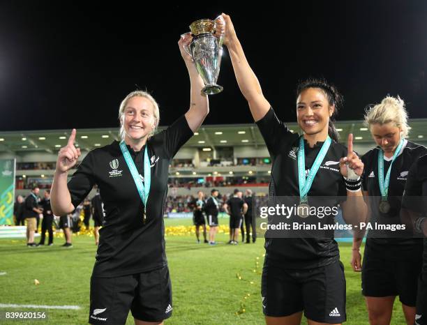 New Zealand's Kelly Brazier and Carla Hohepa pose with the trophy after winning the 2017 Women's World Cup Final at the Kingspan Stadium, Belfast.