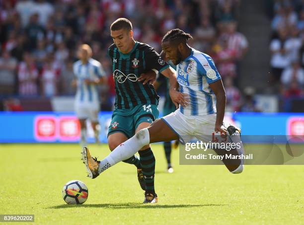 Kasey Palmer of Huddersfield Town tackles Oriol Romeu of Southampton during the Premier League match between Huddersfield Town and Southampton at...