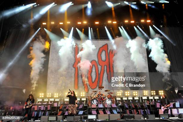 Brian Welch, Johnathan Davis, Ray Luzier and James Shaffer of Korn perform on stage during Day 2 of the Reading Festival at Richfield Avenue on...