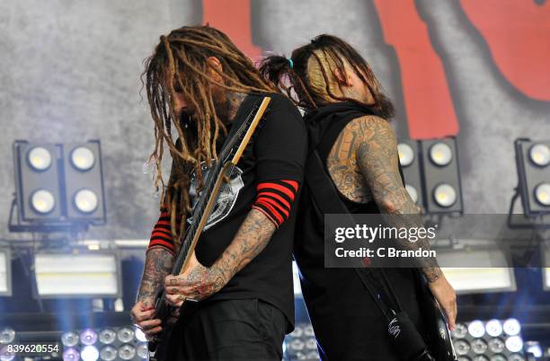 Brian Welch and Reginald Arvizu of Korn perform on stage during Day 2 of the Reading Festival at Richfield Avenue on August 26, 2017 in Reading,...