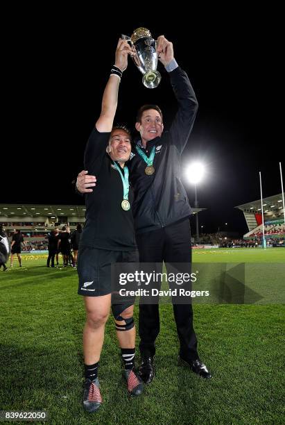 Fiao'o Faamausili of New Zealand and New Zealand Head Coach Brian Smith celebrate with the trophy following the Women's Rugby World Cup 2017 Final...