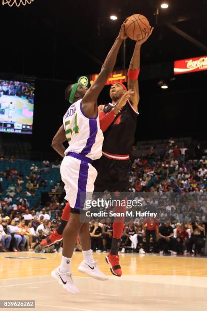 Kwame Brown of 3 Headed Monsters, blocks a shot by Kenyon Martin of Trilogy, during the BIG3 three on three basketball league championship game on...