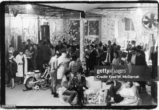 View of the attendees at a party in pop artist Andy Warhol's studio, the Factory , New York, New York, August 31, 1965. Among those pictured are...
