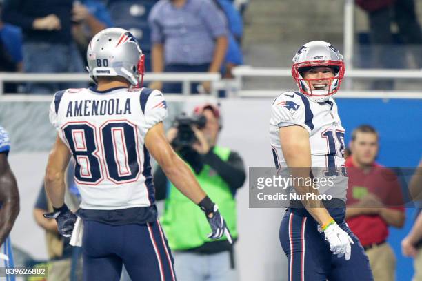 New England Patriots wide receiver Chris Hogan celebrates his touchdown with wide receiver Danny Amendola during the first half of an NFL football...