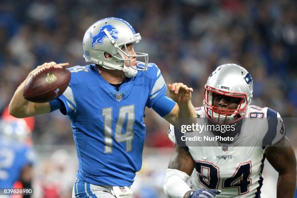 Detroit Lions quarterback Jake Rudock looks to pass during the first half of an NFL football game against the New England Patriots in Detroit,...