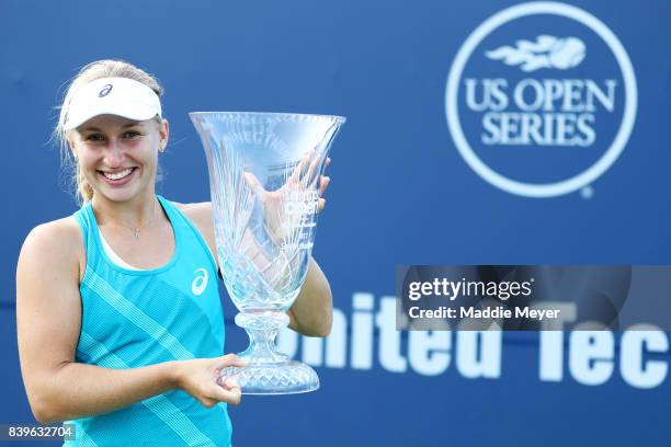 Daria Gavrilova of Australia celebrates with the winners trophy after defeating Dominika Cibulkova of Slovakia to win the Connecticut Open at...