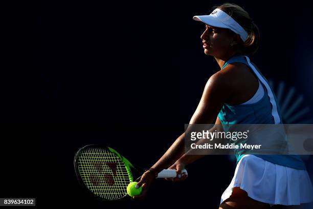 Daria Gavrilova of Australia serves to Dominika Cibulkova of Slovakia to win the Connecticut Open at Connecticut Tennis Center at Yale on August 26,...