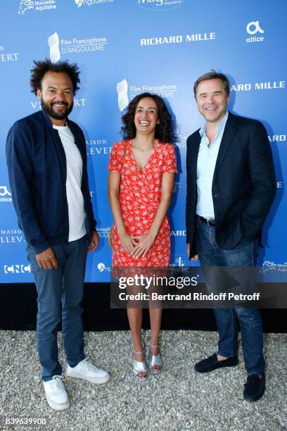 Team of the movie "Coexister", director Fabrice Eboue, actors Amelle Chahbi and Guillaume de Tonquedec attend the 10th Angouleme French-Speaking Film...