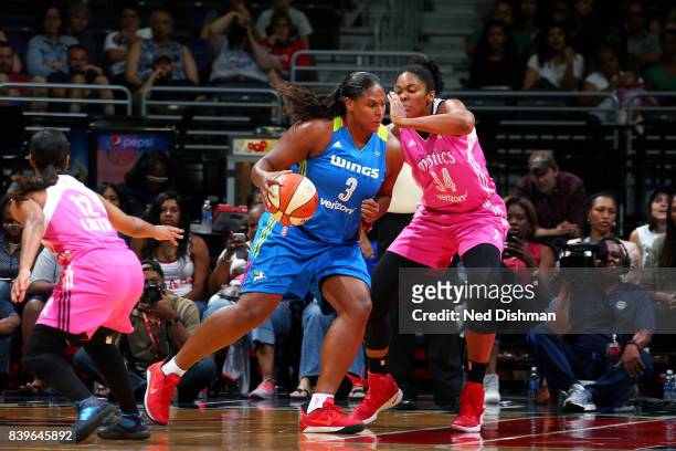 Courtney Paris of the Dallas Wings handles the ball against Krystal Thomas of the Washington Mystics during a WNBA game on August 26, 2017 at the...