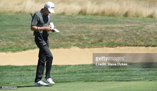 Aaron Wise checks his book as he walks up the second hole during round three of the WinCo Foods Portland Open at Pumpkin Ridge Golf Club - Witch...
