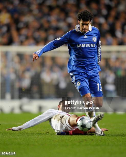 Michael Ballack of Chelsea is challenged by Eugen Trica of CFR 1907 Cluj-Napoca during the UEFA Champions League match between Chelsea and CFR 1907...