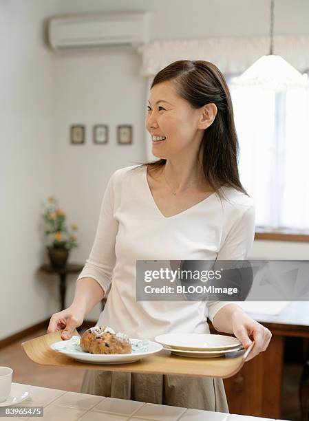 woman setting the table - plate side view stock pictures, royalty-free photos & images