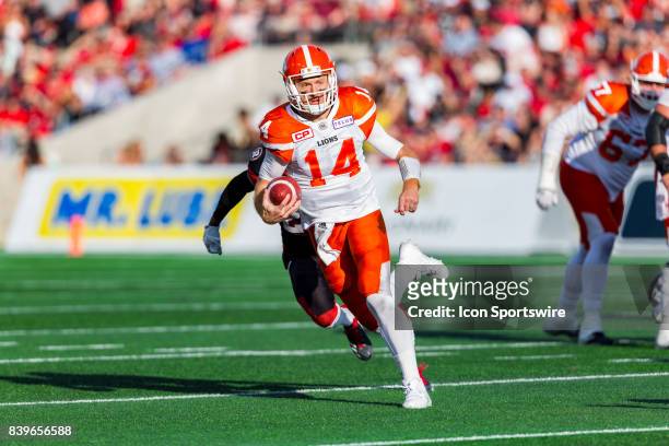 Lions quarterback Travis Lulay runs with the football during Canadian Football League action between BC Lions and Ottawa RedBlacks on August 26, 2017...