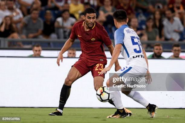 Gregoire Defrel of Roma is challenged by Yuto Nagatomo of Internazionale during the Serie A match between Roma and Internazionale at Stadio Olimpico,...