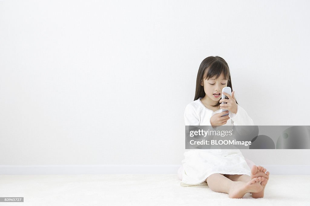 Girl using cellular phone