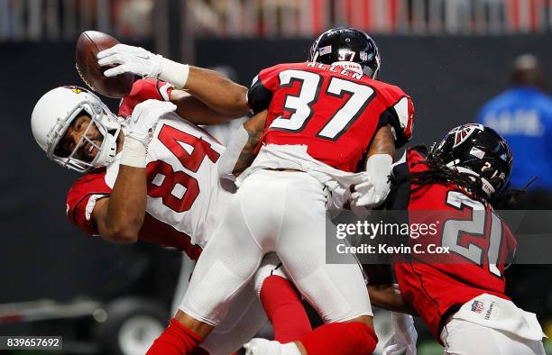 Jermaine Gresham of the Arizona Cardinals fails to pull in this touchdown reception against Ricardo Allen and Desmond Trufant of the Atlanta Falcons...