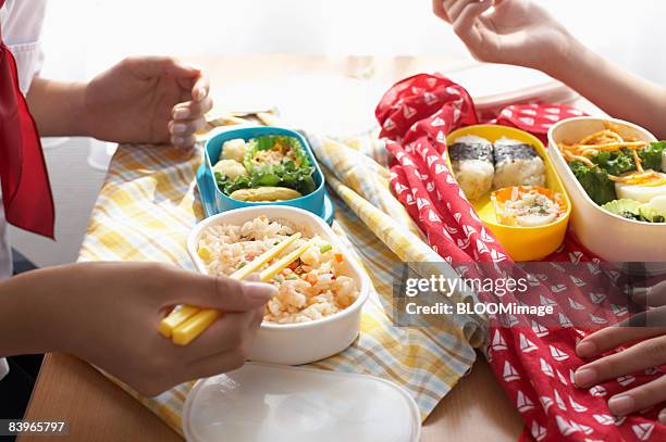 girl students having lunch - packed lunch stock pictures, royalty-free photos & images