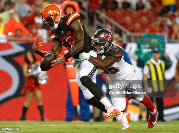 Defensive back Robert McClain of the Tampa Bay Buccaneers breaks up a pass intended for wide receiver Kenny Britt of the Cleveland Browns during the...