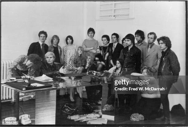 Portrait of American pop artist Andy Warhol and others assembled for a photo shoot with Cecil Beaton at Warhol's studio, the Factory , New York, New...