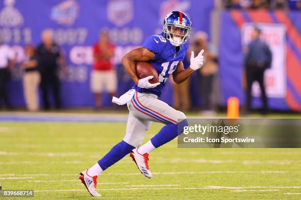 New York Giants wide receiver Travis Rudolph runs after the catch during the second quarter of the National Football League preseason game between...