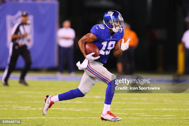New York Giants wide receiver Travis Rudolph runs after the catch during the second quarter of the National Football League preseason game between...