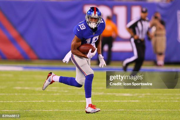 New York Giants wide receiver Travis Rudolph runs after the catch during the second quarter of the National Football League preseason game between...