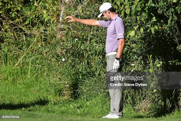 Lanto Griffin takes a drop near the 14th green during round three of the WinCo Foods Portland Open at Pumpkin Ridge Golf Club - Witch Hollow on...