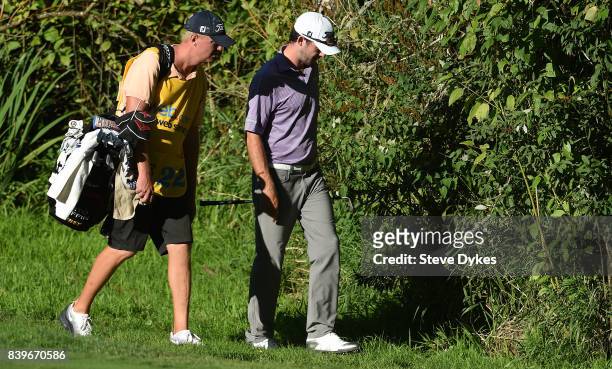 Lanto Griffin and his caddie look for his ball near the 14th green during round three of the WinCo Foods Portland Open at Pumpkin Ridge Golf Club -...