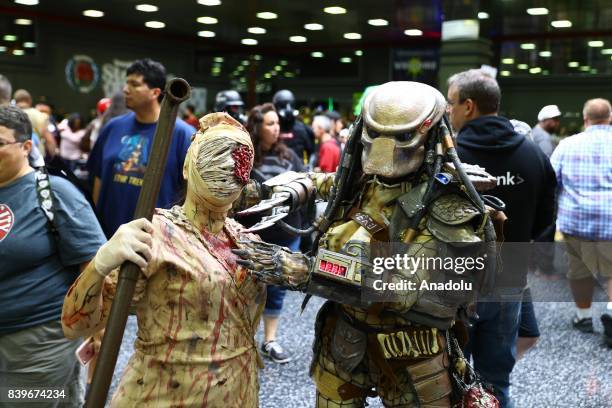 People attend Wizard World Comic Con Fair with their costumes at Donald E. Stephens Congress Center in Chicago, United States on August 26, 2017.