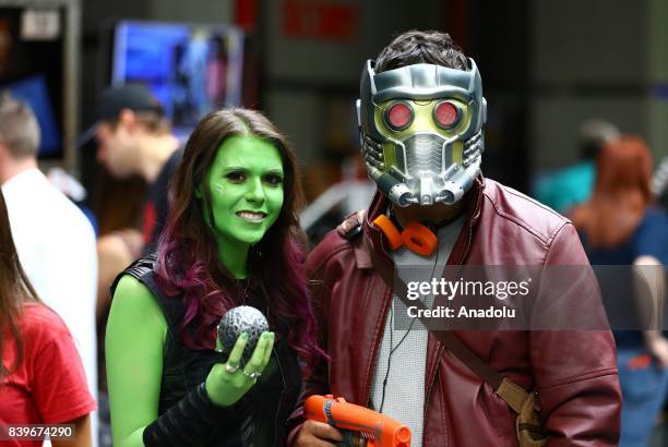 People attend Wizard World Comic Con Fair with their costumes at Donald E. Stephens Congress Center in Chicago, United States on August 26, 2017.