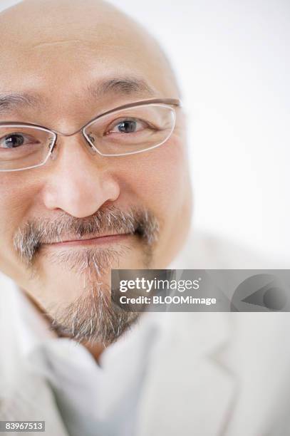 portrait of mature man, close up, studio shot - portrait close up loosely stock pictures, royalty-free photos & images