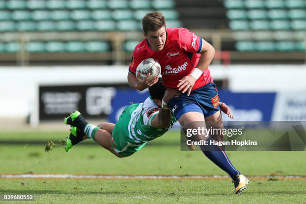 Alex Nankivell of Tasman beats the tackle of Lewis Marshall of Manawatu during the Mitre 10 Cup match between Manawatu and Tasman at Central Energy...