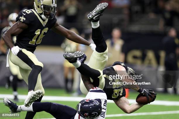 Kurtis Drummond of the Houston Texans tackles Braedon Bowman of the New Orleans Saints at Mercedes-Benz Superdome on August 26, 2017 in New Orleans,...