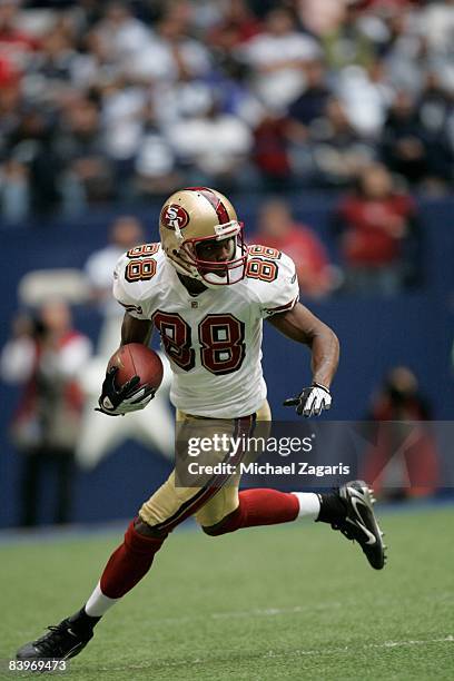 Isaac Bruce of the San Francisco 49ers makes a reception during an NFL football game against the Dallas Cowboys at Texas Stadium on November 23, 2008...