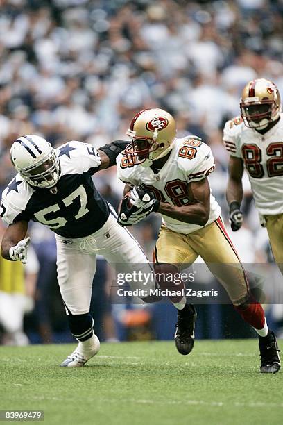 Isaac Bruce of the San Francisco 49ers makes a reception during an NFL football game against the Dallas Cowboys at Texas Stadium on November 23, 2008...