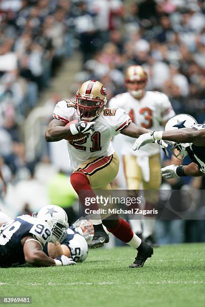 Frank Gore of the San Francisco 49ers runs with the ball during an NFL football game against the Dallas Cowboys at Texas Stadium on November 23, 2008...