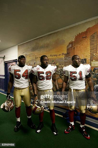 Roderick Green, Patrick Willis and Takeo Spikes of the San Francisco 49ers prepare to enter the field before an NFL football game against the Dallas...