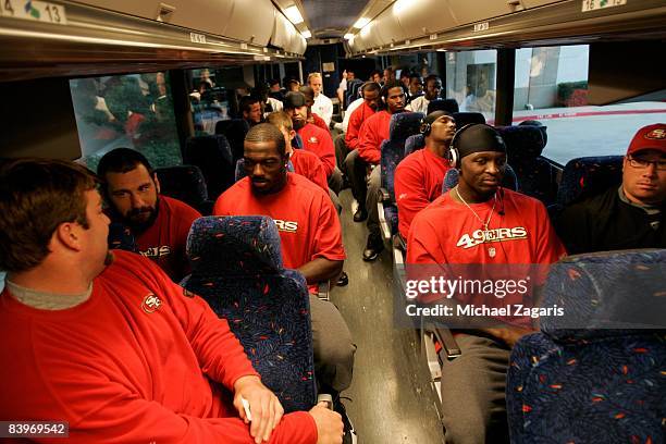 Members of the San Francisco 49ers travel into the stadium on the bus before an NFL football game against the Dallas Cowboys at Texas Stadium on...
