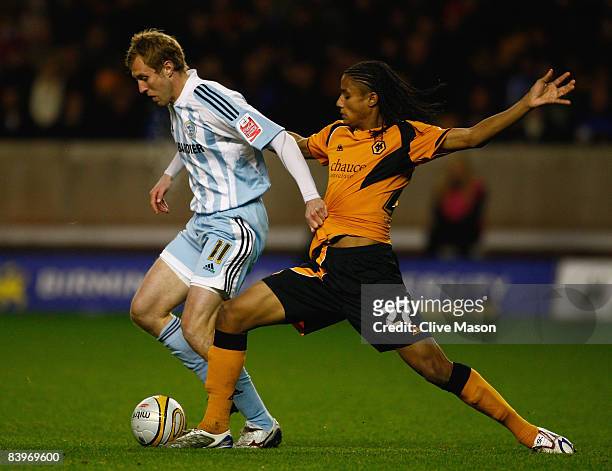 Michael Mancienne of Wolves tackles Rob Hulse of Derby during the Coca-Cola Championship match between Wolverhampton Wanderers and Derby County at...
