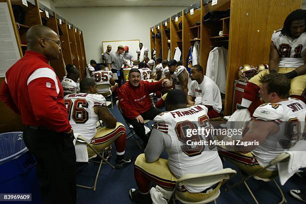 Jim Tomsula addresses the defensive line of the San Francisco 49ers in the locker room at halftime during an NFL football game against the Dallas...