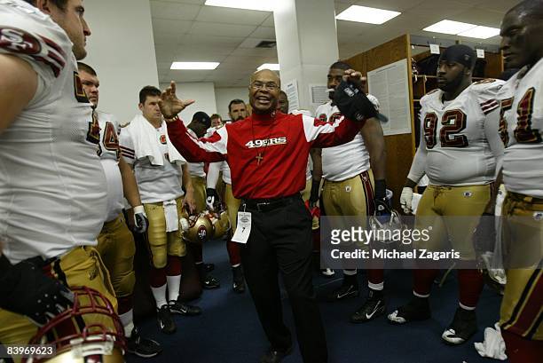 Head coach Mike Singletary of the San Francisco 49ers addresses the team in the locker room at halftime during an NFL football game against the...