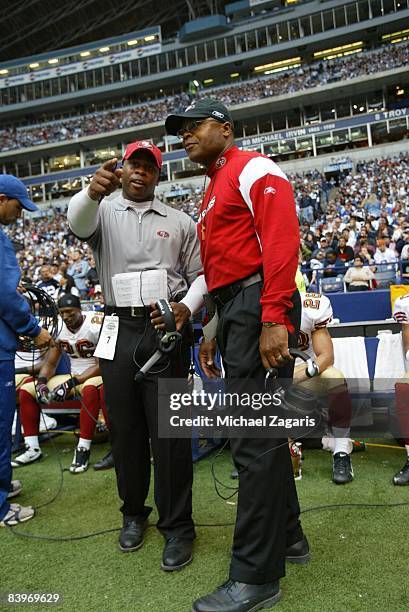 Vance Joseph talks with head coach Mike Singletary of the San Francisco 49ers during an NFL football game against the Dallas Cowboys at Texas Stadium...