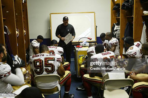 Greg Manusky addresses the defensive line of the San Francisco 49ers in the locker room at halftime during an NFL football game against the Dallas...