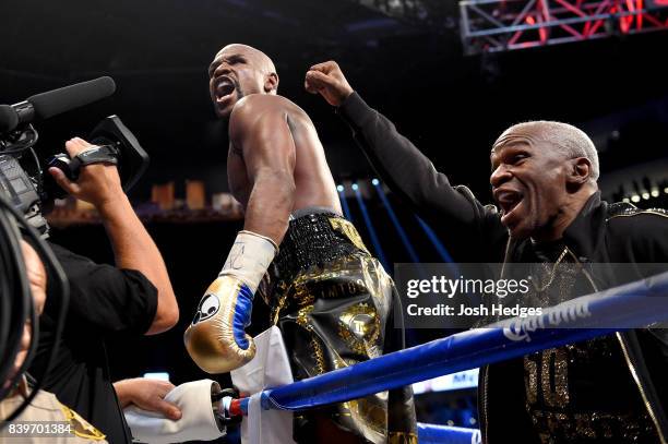 Floyd Mayweather Jr. And Floyd Mayweather Sr. Celebrate after defeating Conor McGregor during their super welterweight boxing match on August 26,...