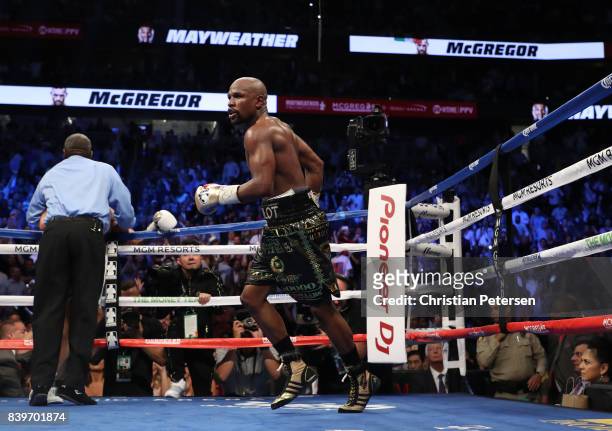 Floyd Mayweather Jr. Celebrates his TKO of Conor McGregor in their super welterweight boxing match on August 26, 2017 at T-Mobile Arena in Las Vegas,...