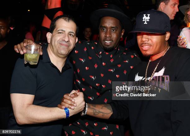 Showtime Sports Executive Vice President and General Manager Stephen Espinoza and rappers Sean "Diddy" Combs and Nas attend the Double or Nothing...