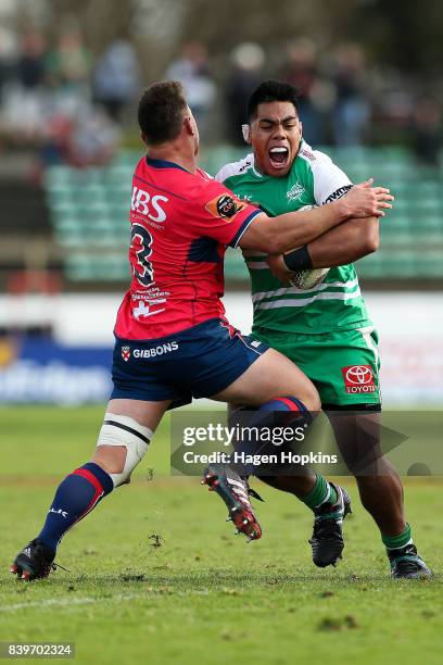 Michael Alaalatoa of Manawatu is tackled by Isaac Salmon of Tasman during the Mitre 10 Cup match between Manawatu and Tasman at Central Energy Trust...