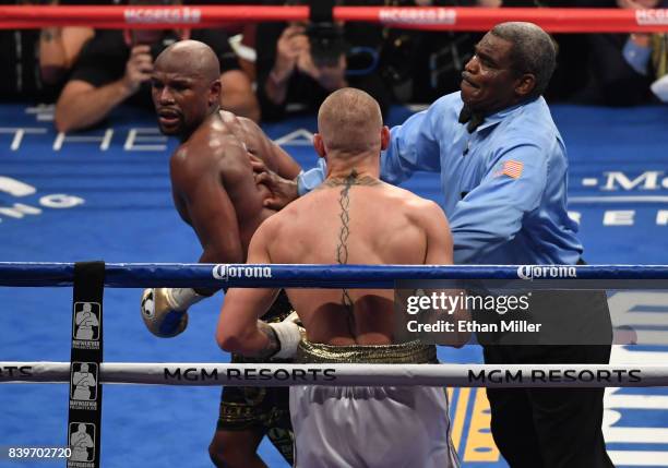 Floyd Mayweather Jr. Reacts as referee Robert Byrd stops his super welterweight boxing match against Conor McGregor to give Mayweather a 10th-round...