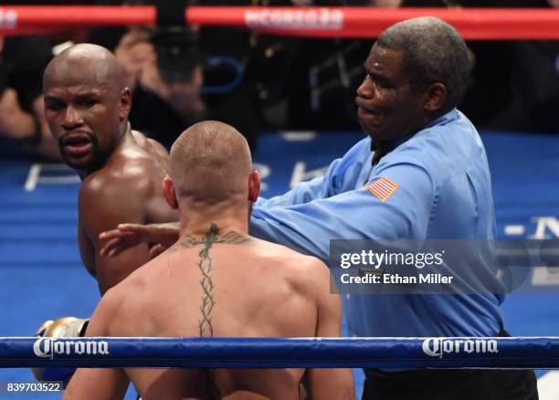 Floyd Mayweather Jr. Reacts as referee Robert Byrd stops his super welterweight boxing match against Conor McGregor to give Mayweather a 10th-round...